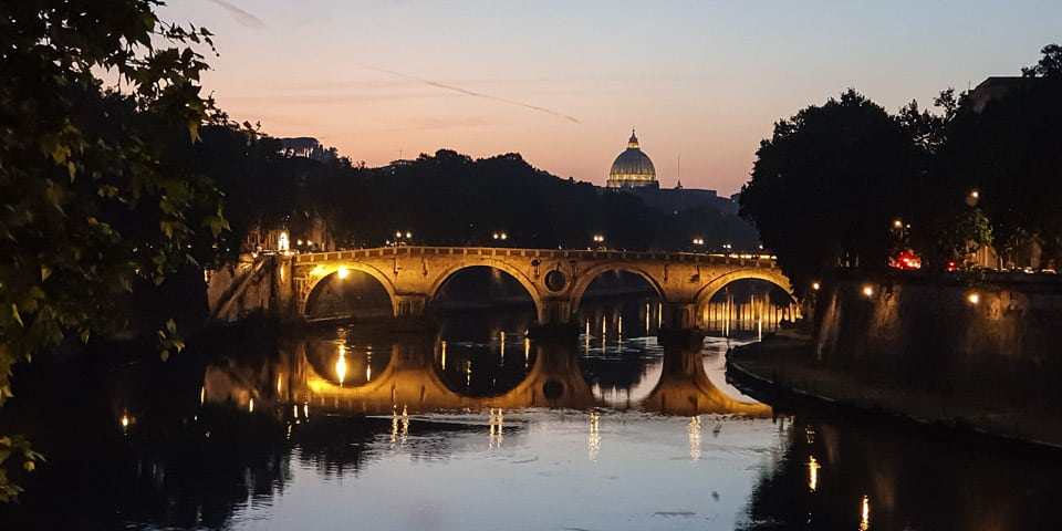 Postcard view of the Sixtus Bridge the Tiber River and the dome of St Peter's Basilica